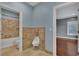Bathroom featuring tile accents, walk in shower, and an adjacent bedroom at 6487 Ashley Dr, Lakeland, FL 33813