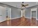 Large bedroom featuring an attached bath, closet and dark hardwood floors at 6487 Ashley Dr, Lakeland, FL 33813