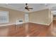 This bedroom features hardwood floors, crown molding, a ceiling fan and built-in media center at 6487 Ashley Dr, Lakeland, FL 33813