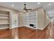 Inviting bonus room featuring hardwood floors, recessed lighting and built-in shelving at 6487 Ashley Dr, Lakeland, FL 33813
