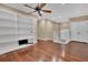 Bright bonus room with hardwood floors, ceiling fan, recessed lights and built-in shelving at 6487 Ashley Dr, Lakeland, FL 33813