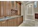 Dining area with a built-in bar, wine rack, and cabinets for storage at 6487 Ashley Dr, Lakeland, FL 33813