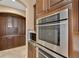 Gourmet kitchen with built in oven, microwave and custom cabinetry with wine rack at 6487 Ashley Dr, Lakeland, FL 33813