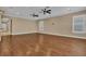 Spacious living room featuring hardwood floors, recessed lighting, and plantation shutters at 6487 Ashley Dr, Lakeland, FL 33813