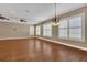 Spacious living room with hardwood flooring, plantation shutters, ceiling fans and recessed lighting at 6487 Ashley Dr, Lakeland, FL 33813
