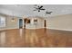 Large living room showing the hardwood floors and open access to the kitchen at 6487 Ashley Dr, Lakeland, FL 33813