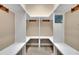 Mudroom area featuring hooks, shelving, and bench seating at 6487 Ashley Dr, Lakeland, FL 33813