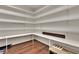 Walk-in pantry with ample shelving space for organized storage at 6487 Ashley Dr, Lakeland, FL 33813