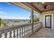 Covered patio with detailed banister, stained wood ceiling, and view of the neighborhood at 6487 Ashley Dr, Lakeland, FL 33813