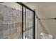 Frameless shower features slate tile, decorative accents, a hand-held showerhead and a built-in bench at 6487 Ashley Dr, Lakeland, FL 33813