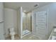 Clean bathroom features a glass door shower and tiled floor at 1484 Leamington Ln, Winter Haven, FL 33884