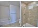 Bathroom with large shower, tub, tile floor, and neutral paint at 1484 Leamington Ln, Winter Haven, FL 33884
