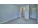Bright bedroom features neutral carpet, recessed lighting and a closet with an open white door at 1484 Leamington Ln, Winter Haven, FL 33884
