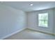 Neutral bedroom with carpet floors and window for natural light at 1484 Leamington Ln, Winter Haven, FL 33884