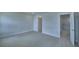 Open bedroom showcases a door to a walk-in closet and an ensuite bathroom at 1484 Leamington Ln, Winter Haven, FL 33884