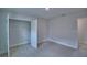 Carpeted bedroom offers a walk-in closet and bright natural light at 1484 Leamington Ln, Winter Haven, FL 33884