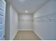 Walk-in closet with wire shelving, ready to be filled with your personal items at 1484 Leamington Ln, Winter Haven, FL 33884