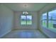 Bright dining room with natural light and simple chandelier at 1484 Leamington Ln, Winter Haven, FL 33884