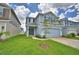 Beautiful two-story home with a well-manicured lawn and a driveway leading to an attached garage at 1484 Leamington Ln, Winter Haven, FL 33884