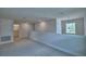 Neutral carpet and paint colors create a calming space, accented with natural light and modern recessed lighting at 1484 Leamington Ln, Winter Haven, FL 33884