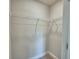 Spacious walk-in closet with wire shelving and carpet flooring at 1484 Leamington Ln, Winter Haven, FL 33884