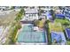 Aerial view of community tennis and basketball courts, pool and playground at 4670 Grandview Glen Dr, Auburndale, FL 33823