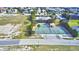Aerial view of the community tennis and basketball courts, pool and playground at 4670 Grandview Glen Dr, Auburndale, FL 33823
