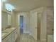 Bathroom featuring a double sink vanity with granite countertops, a shower and bathtub at 4670 Grandview Glen Dr, Auburndale, FL 33823