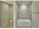 Bathroom featuring a shower and bathtub with tile surround at 4670 Grandview Glen Dr, Auburndale, FL 33823