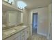Bathroom featuring a double sink vanity with granite countertops, a shower and bathtub at 4670 Grandview Glen Dr, Auburndale, FL 33823