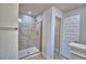 Modern bathroom with tiled walk-in shower and glass door, offering a spa-like experience at 4670 Grandview Glen Dr, Auburndale, FL 33823