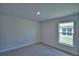 Bedroom with a window overlooking the yard at 4670 Grandview Glen Dr, Auburndale, FL 33823