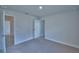Bright bedroom featuring neutral carpet and white trim, bathed in natural light at 4670 Grandview Glen Dr, Auburndale, FL 33823