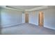 Expansive bedroom features a tray ceiling, recessed lights, and multiple doorways for easy access at 4670 Grandview Glen Dr, Auburndale, FL 33823