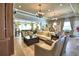 Open-concept common area featuring living, dining, and lounge spaces with stylish furnishings and decor at 4670 Grandview Glen Dr, Auburndale, FL 33823