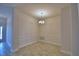 Formal dining room featuring stylish lighting fixture, decorative wall trim and wood-look tile at 4670 Grandview Glen Dr, Auburndale, FL 33823