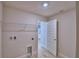 Functional laundry room equipped with washer/dryer hookups and wire shelving for storage at 4670 Grandview Glen Dr, Auburndale, FL 33823