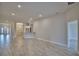 The spacious living room has an open floorplan with recessed lighting and a view to the kitchen at 4670 Grandview Glen Dr, Auburndale, FL 33823