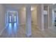 Bright open-concept living area featuring wood-look tile flooring, neutral paint, and an inviting atmosphere at 4670 Grandview Glen Dr, Auburndale, FL 33823