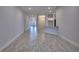 Open-concept living area with wood-look tile flooring and ample natural light at 4670 Grandview Glen Dr, Auburndale, FL 33823