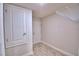 Additional storage space with multiple access doors and wood-look tile flooring at 4670 Grandview Glen Dr, Auburndale, FL 33823