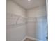 Walk-in closet featuring white wire shelving and neutral carpeting at 4670 Grandview Glen Dr, Auburndale, FL 33823