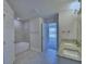 Bright bathroom featuring granite countertops, double vanity, and tiled shower-tub combination at 4938 Vue Delac Pass, Auburndale, FL 33823
