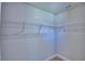 Walk-in closet with ample storage, including multiple wire shelves for organization at 4938 Vue Delac Pass, Auburndale, FL 33823
