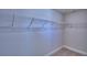 Walk-in closet with ample storage, including multiple wire shelves for organization at 4938 Vue Delac Pass, Auburndale, FL 33823