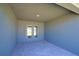 Covered patio features a tiled floor and double doors leading into the house at 4938 Vue Delac Pass, Auburndale, FL 33823
