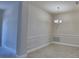 Elegant dining room with chandelier and decorative wall paneling at 4938 Vue Delac Pass, Auburndale, FL 33823