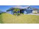 Charming one-story home boasting a manicured lawn and a side-entry two-car garage at 4938 Vue Delac Pass, Auburndale, FL 33823