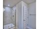 Modern bathroom shower with a glass door and tiled walls at 4938 Vue Delac Pass, Auburndale, FL 33823