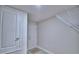 Utility room featuring two doors, overhead rack and connections for a washer and dryer at 4938 Vue Delac Pass, Auburndale, FL 33823